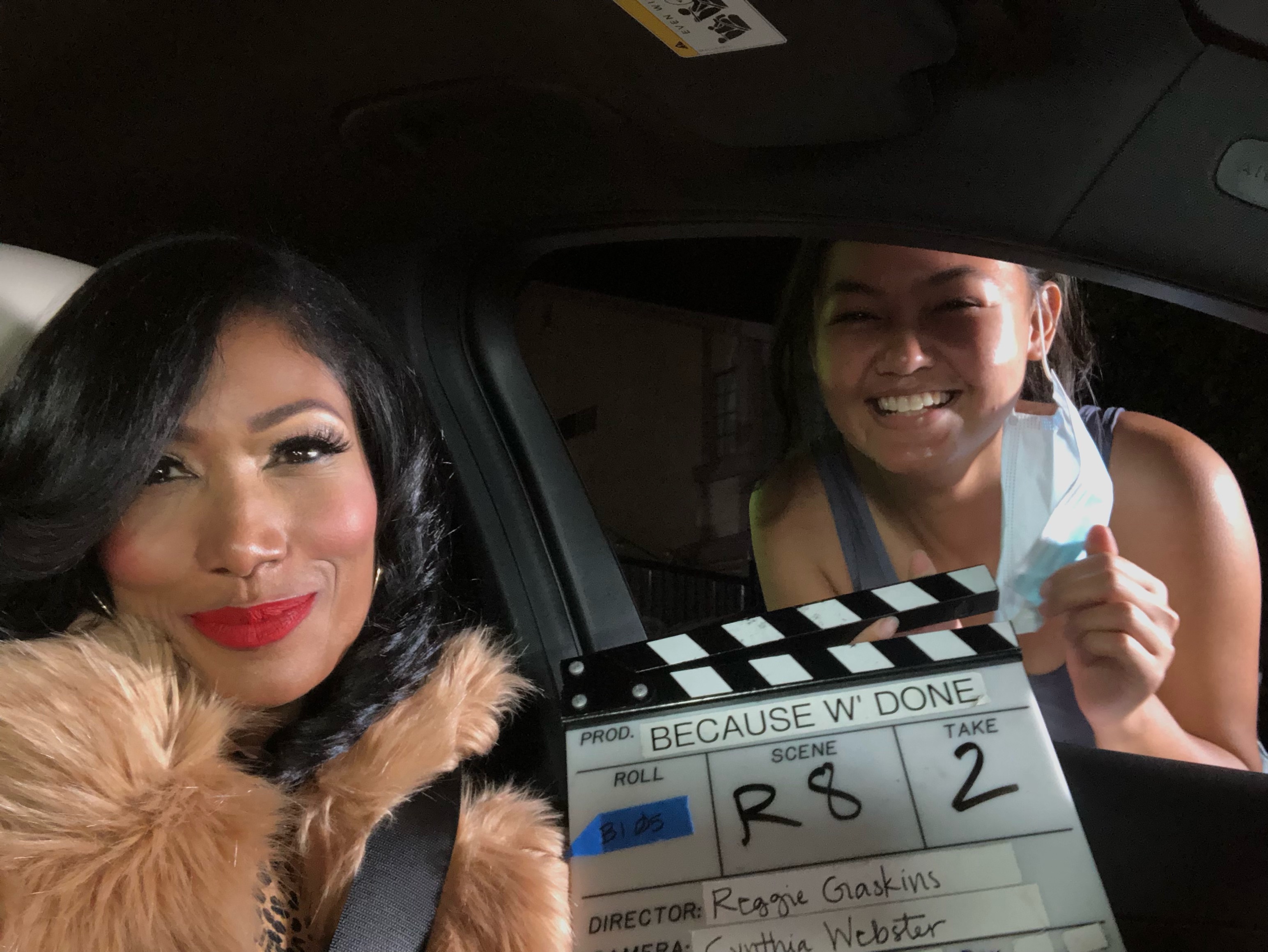 Trisha Mann-Grant on set with clapperboard